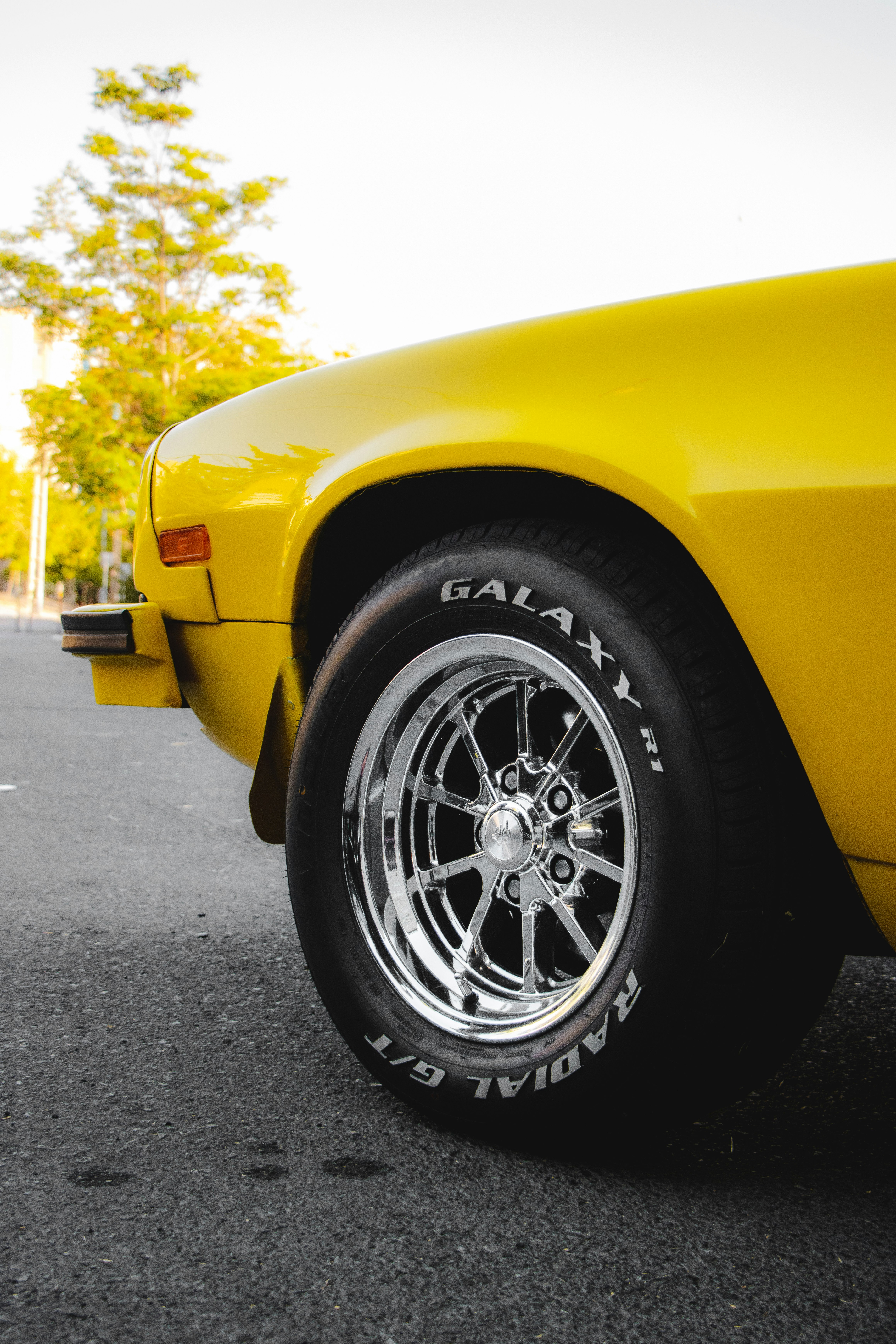 yellow car with black wheel